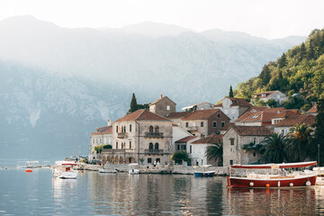 Fototapeta na wymiar Boats are moored off the coast of Perast. Montenegro