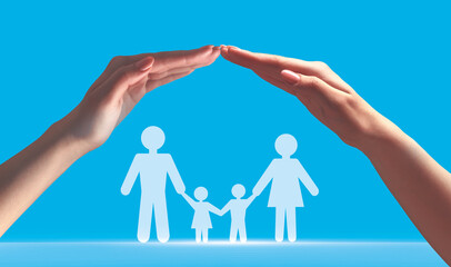 Hands of young european woman make roof and protecting silhouette of family on blue background