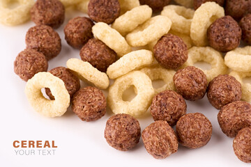Variety of cold cereals, quick breakfast for kids overhead shot. Quick breakfast. Chocolate balls isolated on a white background. Rings isolated on a white background. 