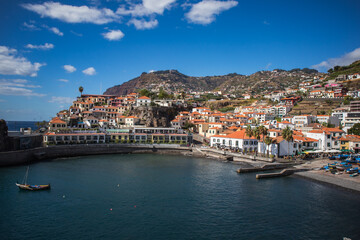 Fototapeta na wymiar promenade overlooking the mountains and a European city on the ocean coast