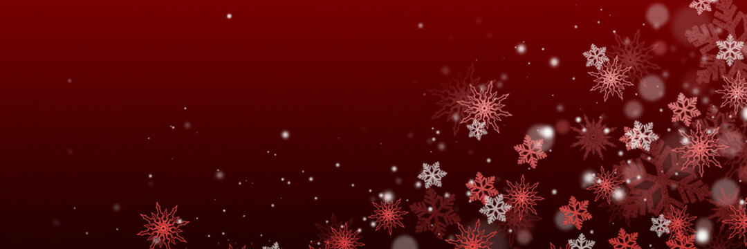 Beautiful snowflakes and bokeh on a dark red background. Wide Christmas background for design and web use.