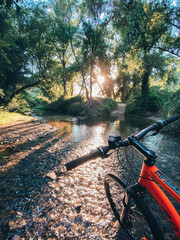 Fototapeta na wymiar bicycle in the low water creek