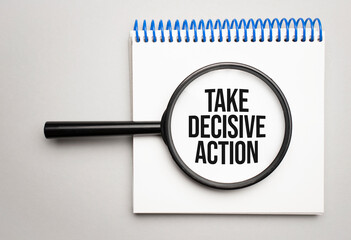 Magnifying glass with the word TAKE DECISIVE ACTION on chart background