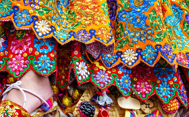 Close up of the skirt called pollera with traditional design for Christmas (Navidad) parade Pase del Nino. It embroidered with silk thread and adorned with sequins and beads. Azuay province, Ecuador