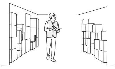 Man surrounded by boxes on shelves.