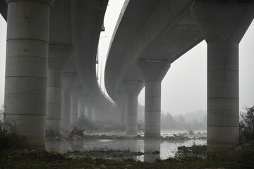 Motorway passing by the river morning landscape , black and white photography 