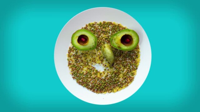 Cartoon animated of character funny grinning faces depicting emotions and smiles is assembled from real seeds, avacado, pear. Funny cartoon Abstract person. Motion design art. 