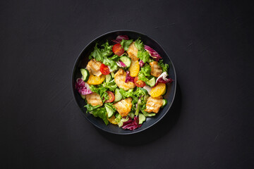 salad with chicken, orange and cucumber, tomatoes