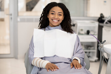Beautiful Young Black Female Patient Waiting For Check Up In Dental Clinic