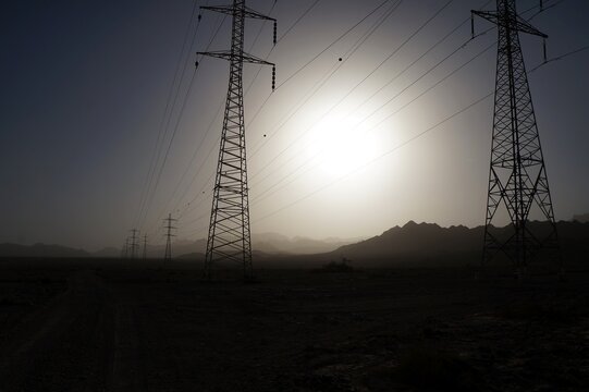 Sand storm in the desert near Eilat upon power line supports