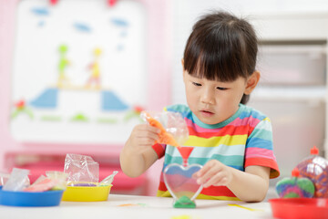 young girl making sand  crafts for homeschooling