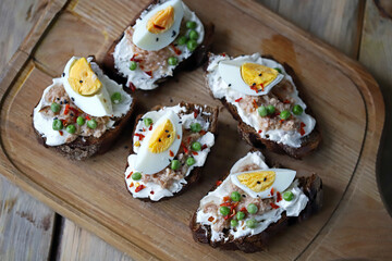 Selective focus. Toast with tuna and egg. Healthy toast. The keto diet.