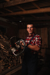 Fototapeta na wymiar farmer in a plaid shirt with a chainsaw