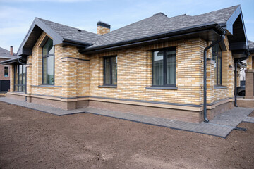 One-story brick house. Construction of low-rise buildings for further sale. Concept of building business.