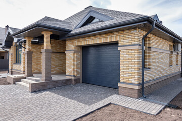 One-story brick house. Construction of low-rise buildings for further sale. Concept of building business.