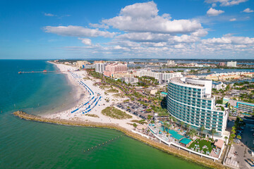 Panorama of Island. City Clearwater Beach FL. Summer vacations in Florida. Beautiful View on Hotels and Resorts. Blue color of Ocean water. American Coast or shore Gulf of Mexico. Aerial photography.