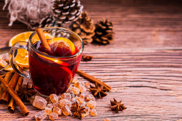 Gluhwein sweet hot warm Mulled red Wine or punch tea in mug cup glass spices citrus aromatic cinnamon star anise German tradition winter Christmas market beverage drink new year holidays festival