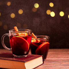 Gluhwein sweet hot warm Mulled red Wine or punch tea in mug cup glass spices citrus aromatic cinnamon star anise German tradition winter Christmas market beverage drink new year holidays festival