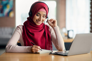 Middle-eastern young lady student attending online webinar