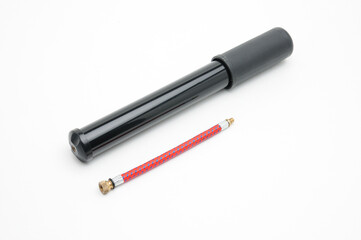 Bicycle pump with hose on white background