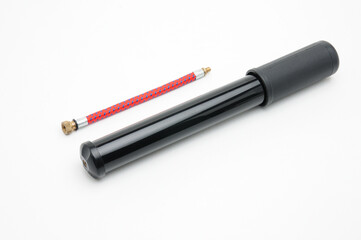 Bicycle pump with hose on white background