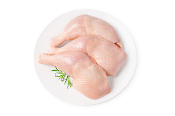 Fresh chicken legs.Three raw whole chicken legs on a white plate on a white isolated background.
