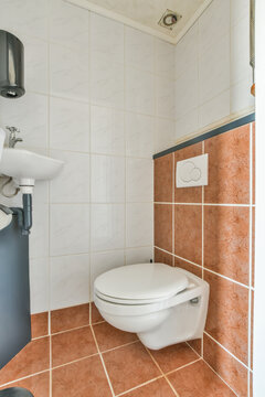 Modern bathroom interior with washstand against toilet bowl