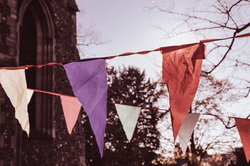 Vintage style bunting hangs outside to celebrate an event