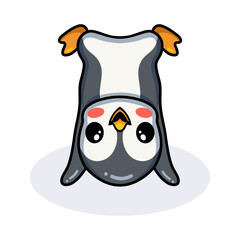Cute little penguin cartoon upside down