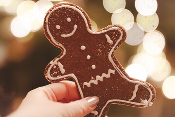 Gingerbread man on Christmas baubles background.