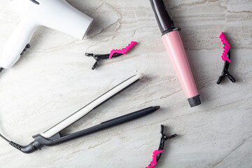 A collection of household tools used for DIY hairdo at home or in salon. The set includes curling...