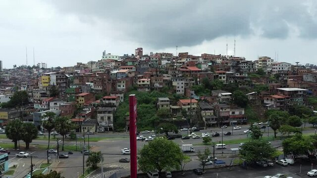 salvador, bahia, brazil - november 24, 2021: movement of vehicles in the region of Vasco da Gama next to popular housing in the city of Salvador.