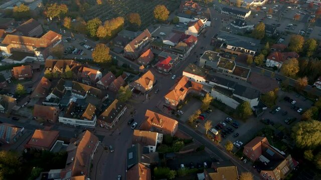 View On The Town Of Friesoythe During Sunrise In Cloppenburg, Lower Saxony, Germany - aerial drone shot