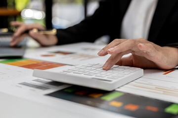 The company's finance manager is using a calculator, he uses a calculator to calculate the numbers in the company's financial documents that employees in the department create as meeting documents.