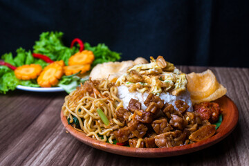 Nasi uduk or Uduk rice, traditional breakfast menu from Indonesia, served with prawn crackers