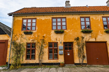 Fototapeta na wymiar Hjorring, Denmark The orange facade of a classic old Danish house.