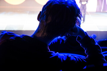Stockholm, Sweden A person at a conference listening to a presentation.