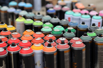 Spray paint cans.