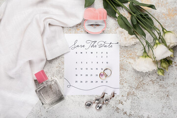 Beautiful composition with wedding calendar on table