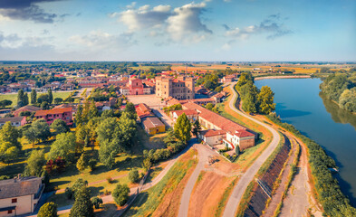 Wonderful summer view from flying drone of Mesola Castle. Bright morning cityscape of Mesola town, Italy, Europe. Traveling concept background.