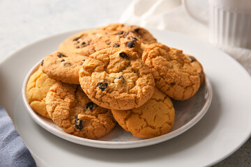 Plate with tasty homemade cookies on white background