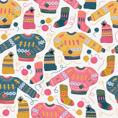 Needlework seamless pattern with sweater, knitting hat, sock and woolen tangles. Hand made clothes.