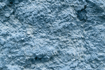 Fototapeta na wymiar Textured stone surface for backdrop. Color Chambray, Hue Blue.