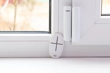 Fotobehang home security system on the windows, opening sensor and remote control in opening and closing, remote control from © Виктория Котлярчук