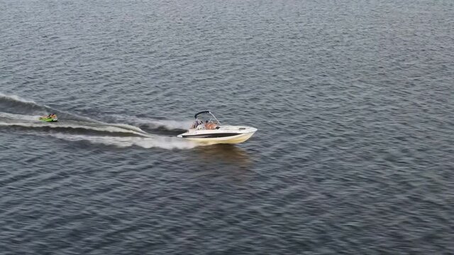 Aerial view of Luxury Speedboat Cruising in deep Ocean water - drone shot