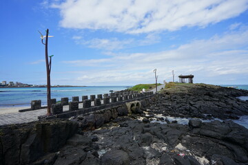 a beautiful seascape with a gazebo