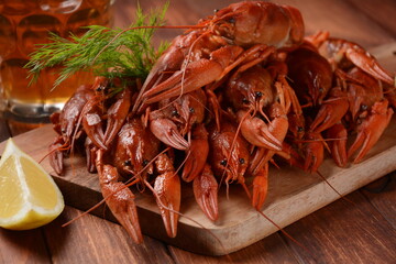 Red boiled crawfishes on table in rustic style. Asian Chinese Food Spicy Crayfish
