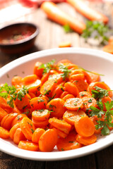 fried carrot with parsley in plate