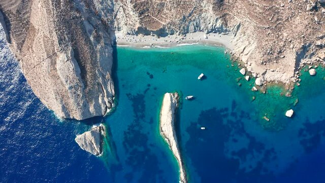Top down view idyllic deep turquoise beach surrounded by rock Cliffs, Katergo Beach