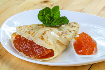 Delicous pancake with fruit jam